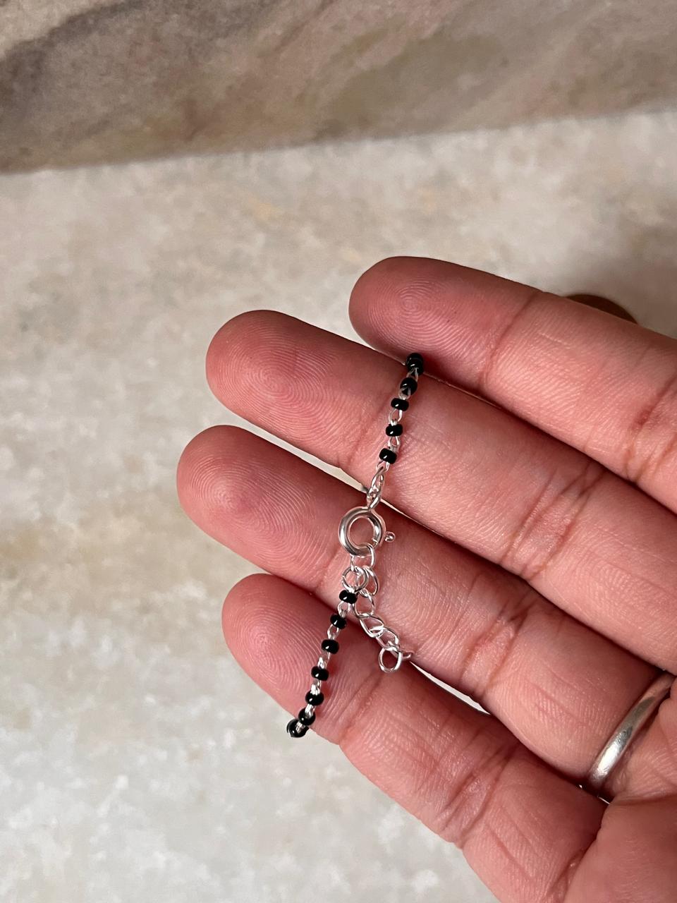Handcrafted black bead anklet with silver ends