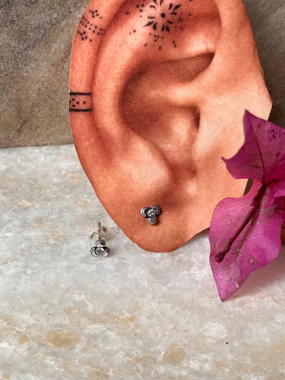 Minimalist white CZ floral studs in 925 sterling silver