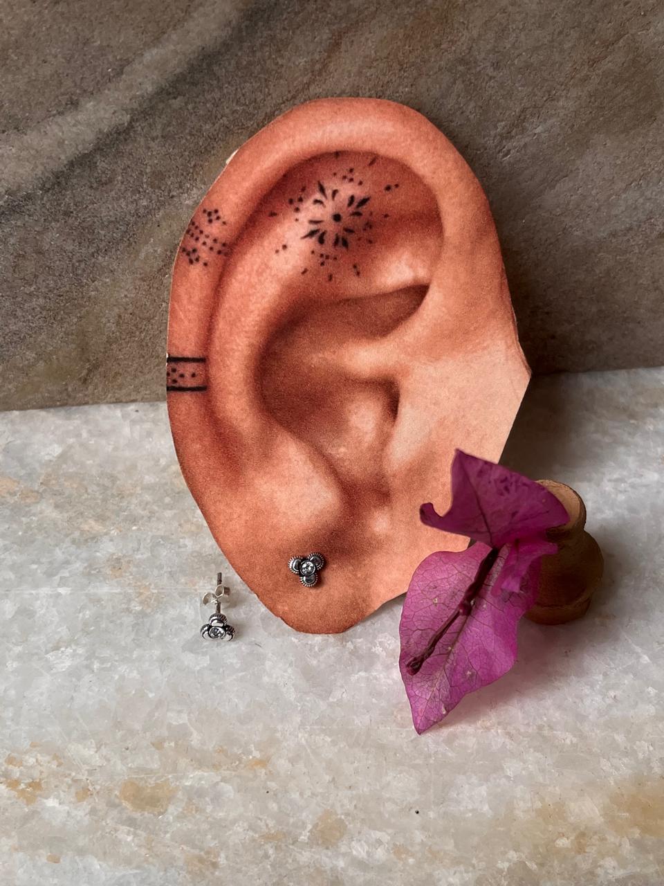 Delicate 925 sterling silver flower studs with white CZ shine