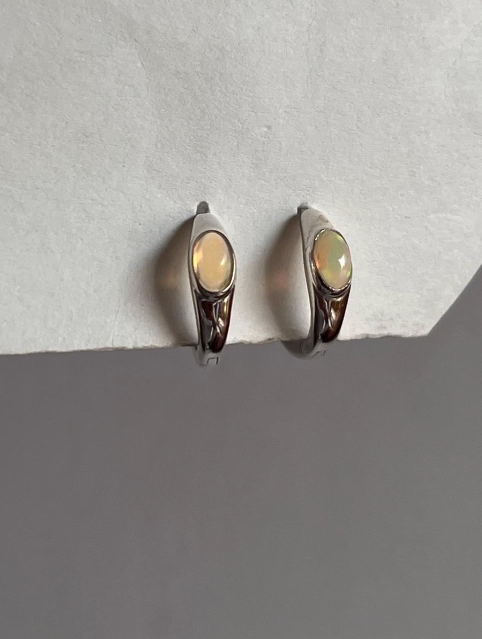 Elegant oval Ethiopian opal huggie earrings in sterling silver