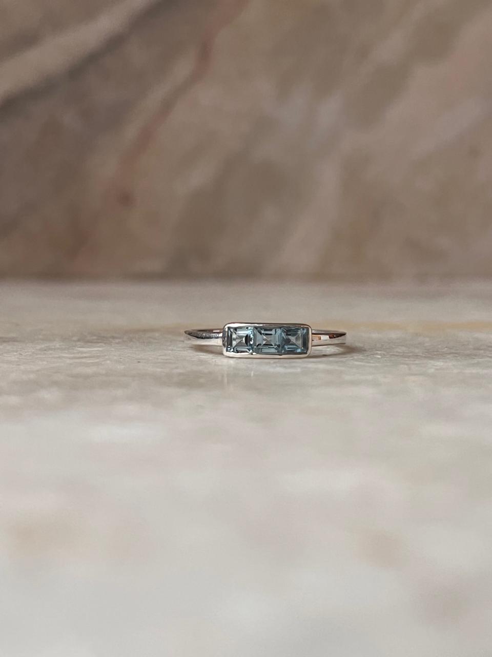 Elegant 3-stone blue topaz silver band ring