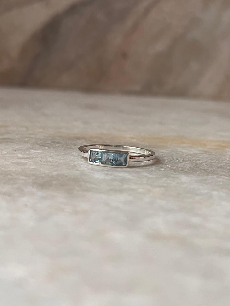 Sterling silver ring with three blue topaz stones