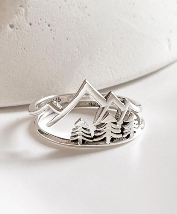 925 Sterling Silver Stack Set featuring mountain and tree designs, perfect for unique layered jewelry styles.