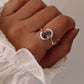 Amethyst Oval Faceted Stone Set in Cross Band Silver Ring