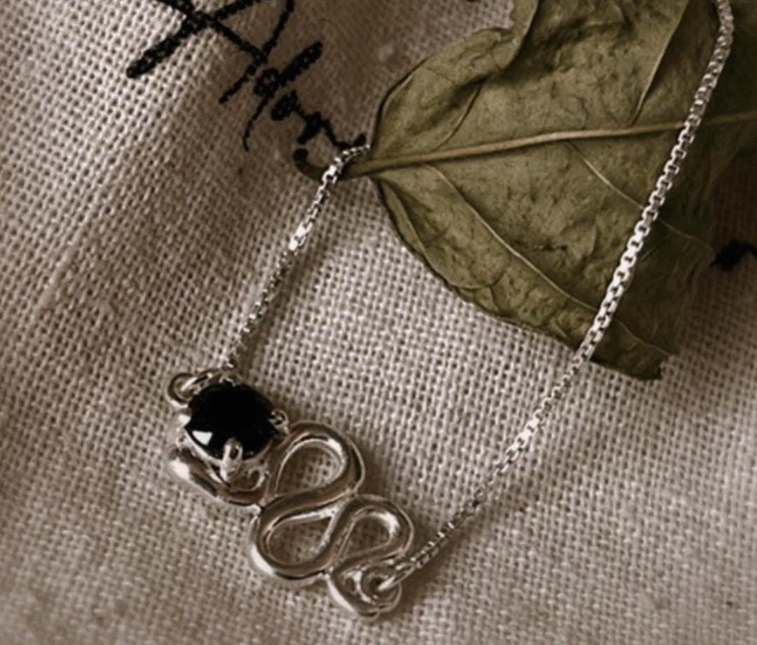 Minimal Silver Bracelet with Black Onyx and Serpent Design