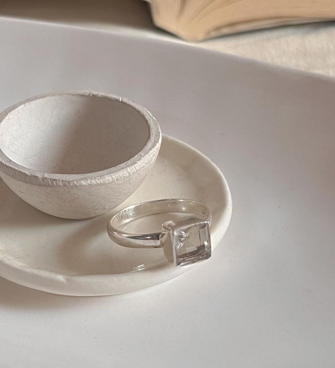 Timeless square cut clear quartz gemstone in a polished silver ring