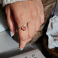 Floral-inspired silver ring with bold garnet flower stone