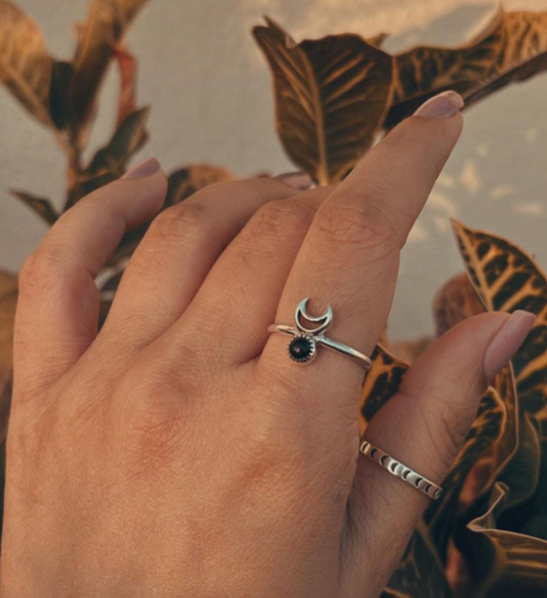 Exquisite black onyx crescent moon silver ring with detailed craftsmanship.