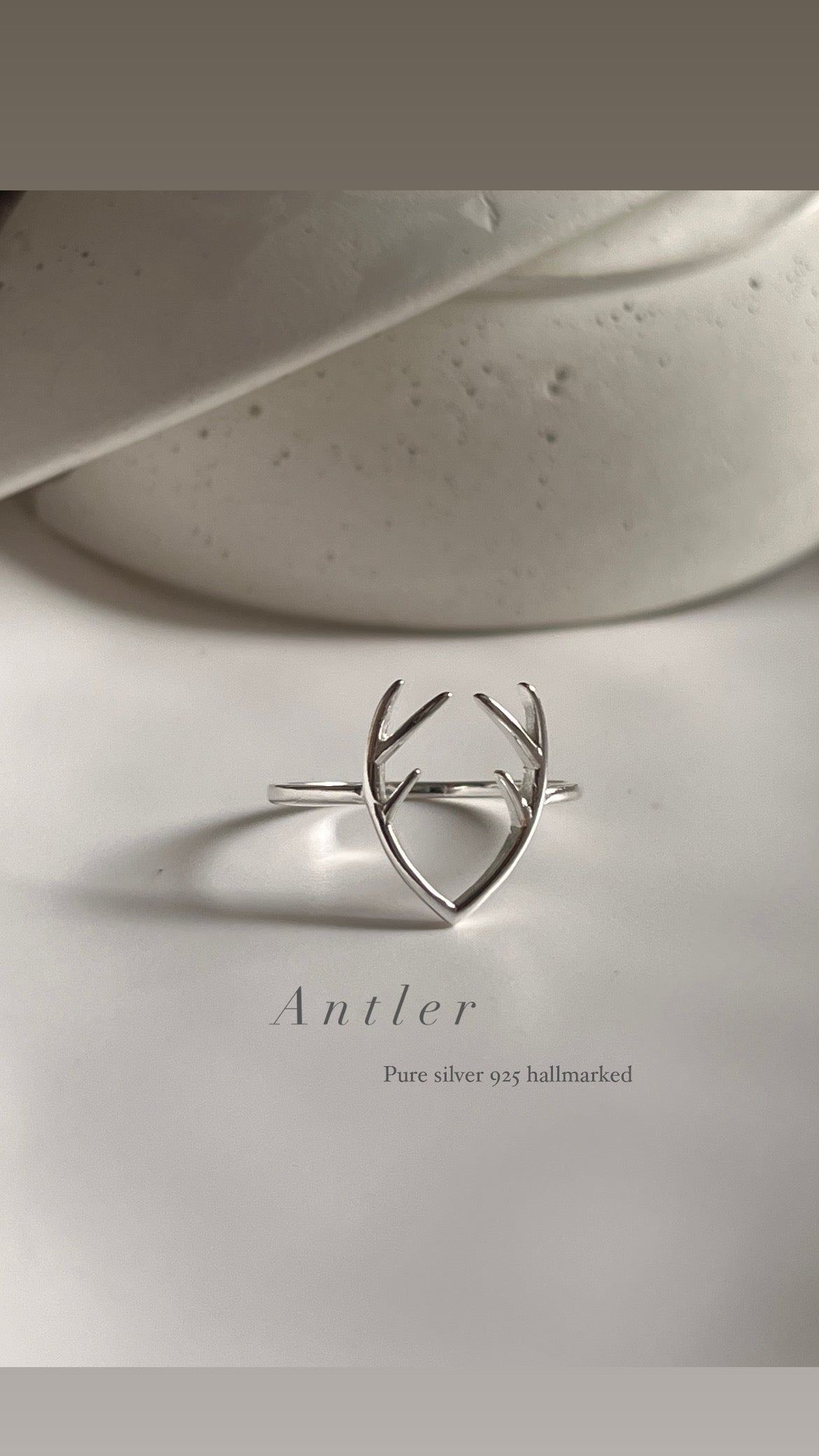 Sterling silver ring with a bold antler-inspired design.