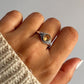 Round citrine stone set in a boho silver ring with delicate accents