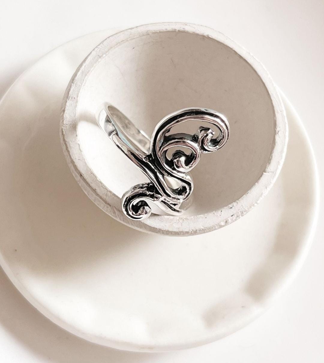 Silver ring with intricate vintage spiral design