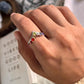 Unique V-shaped silver ring with seven chakra gemstone detail