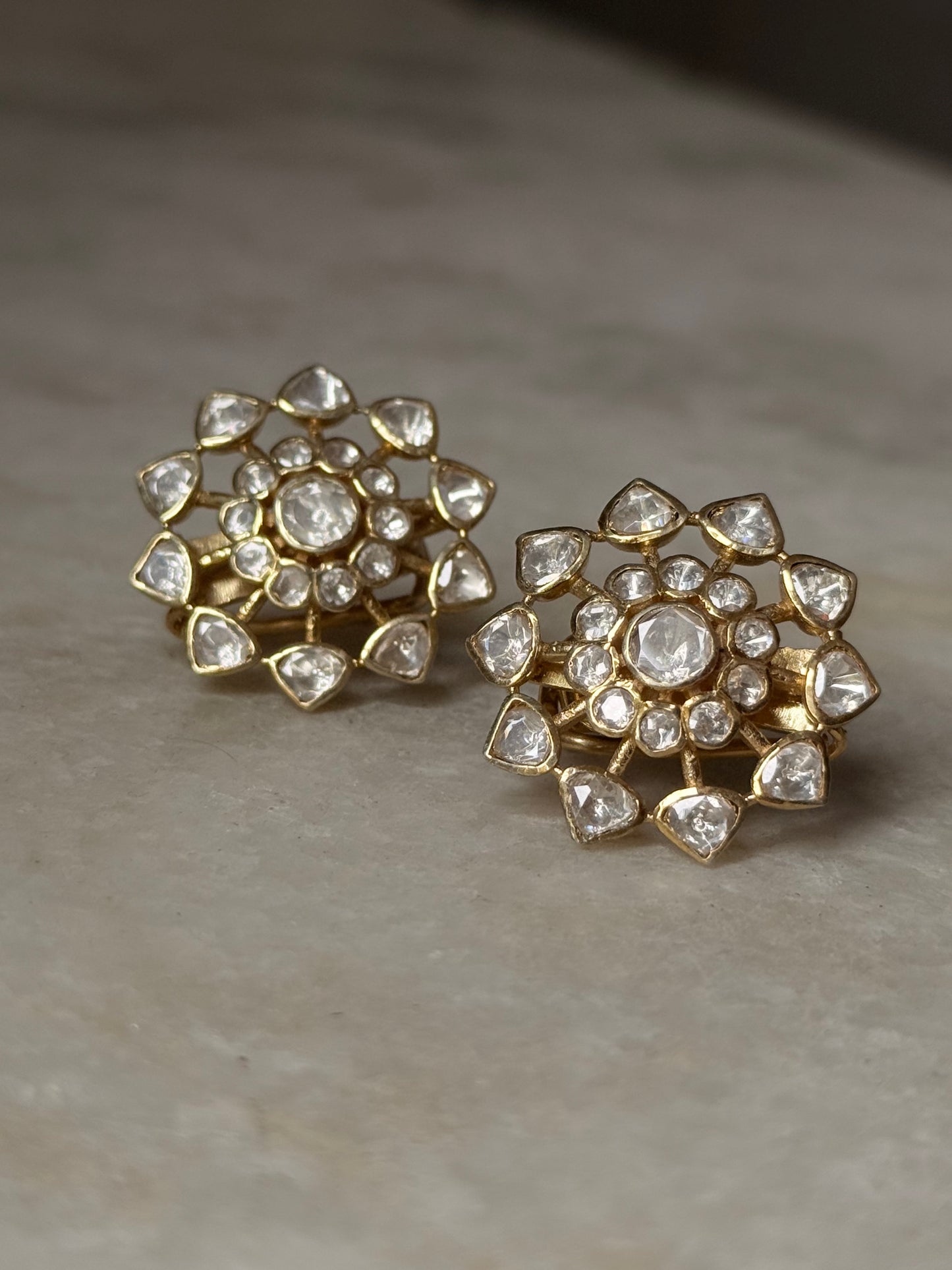 925 Sterling Silver Gold Plated Antique Moissanite Polki Flower Studs Earrings on marble background