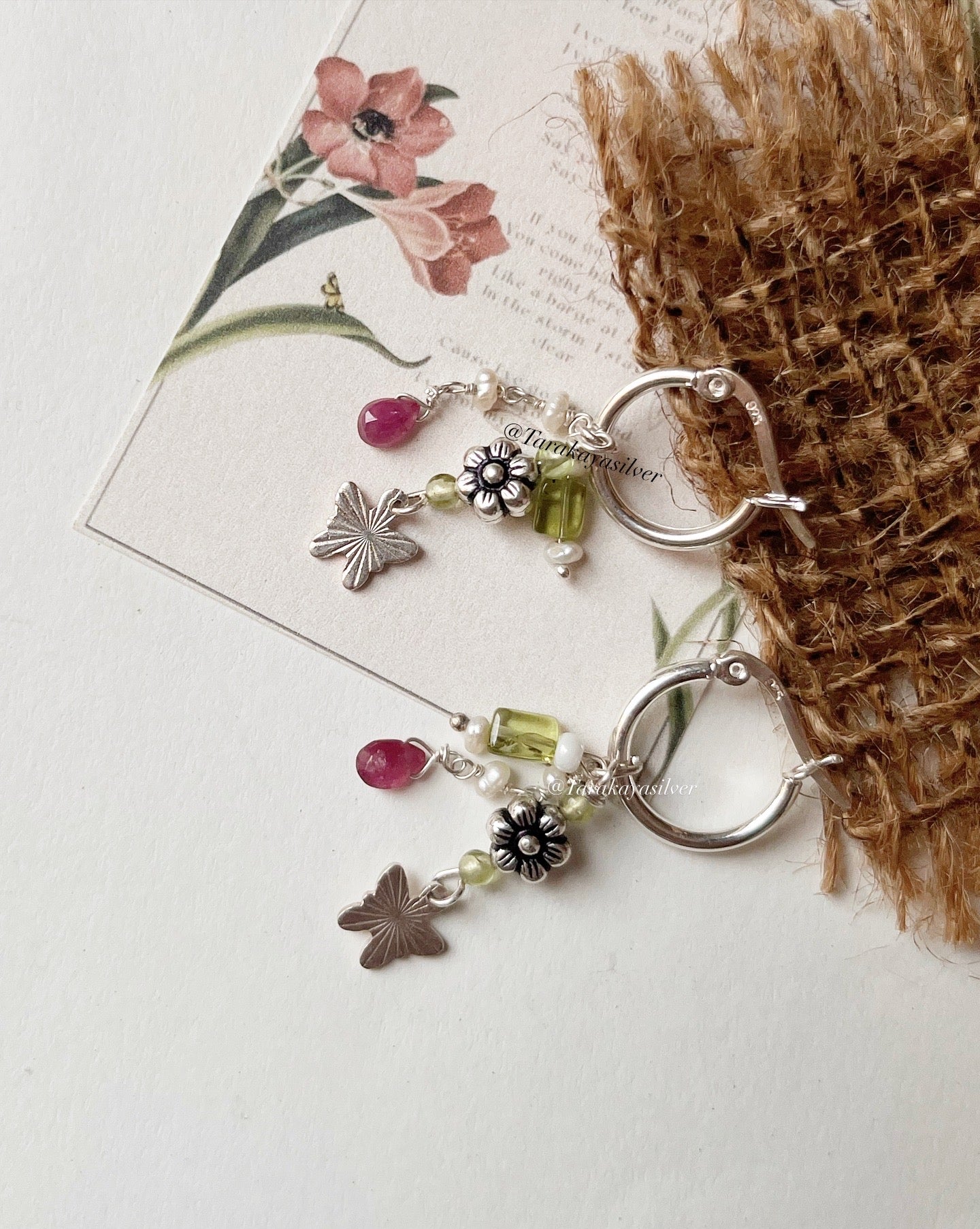 Peridot, pink tourmaline, and pearl charm hoops with floral and butterfly accents