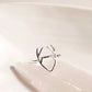 Elegant silver ring featuring an antler motif.