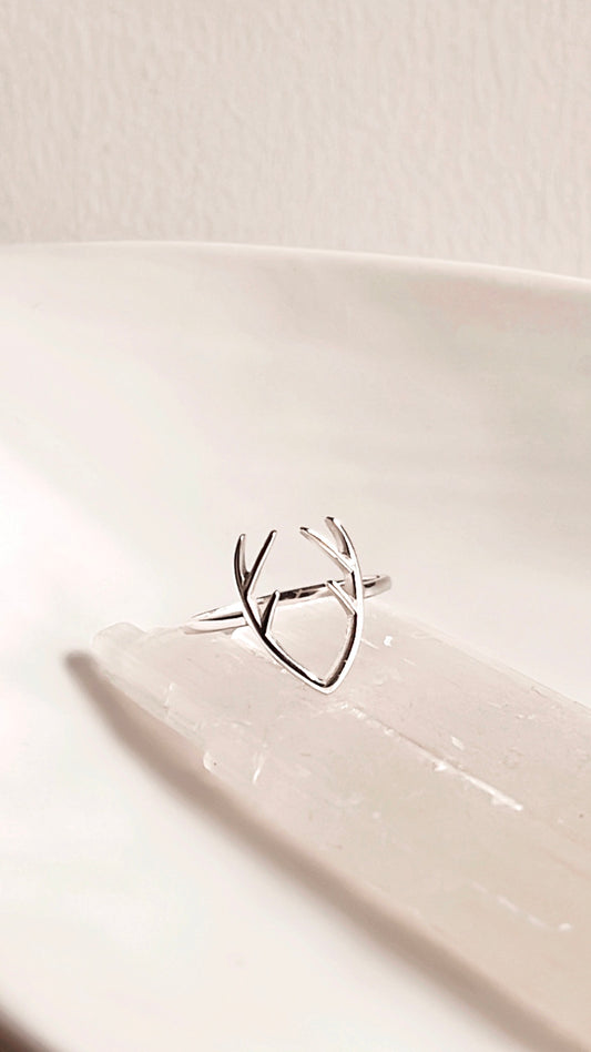 Elegant silver ring featuring an antler motif.