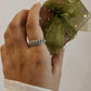 Sleek silver ring with a unique Balinese design and fixed size.