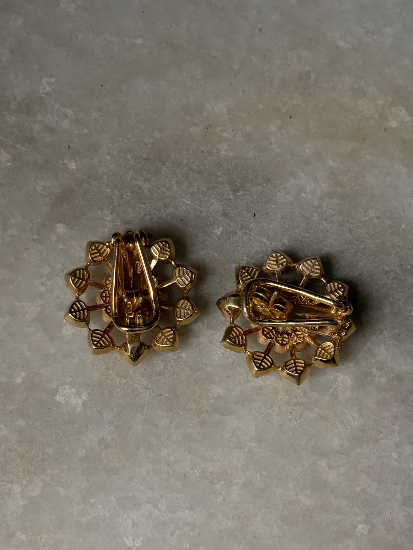 925 Sterling Silver Gold Plated Antique Moissanite Polki Flower Studs Earrings on a marble surface.