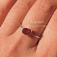 Sterling silver solitaire ring with a pear-cut garnet gemstone