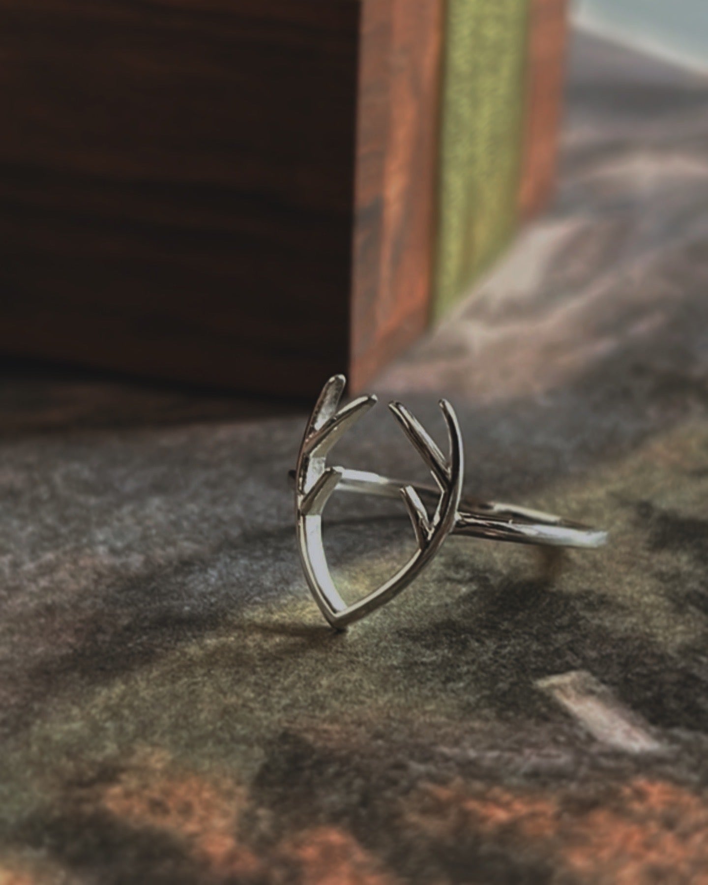Elegant sterling silver ring with a nature-inspired antler pattern.