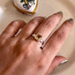 Close-up of citrine square cut gemstone set in a silver ring