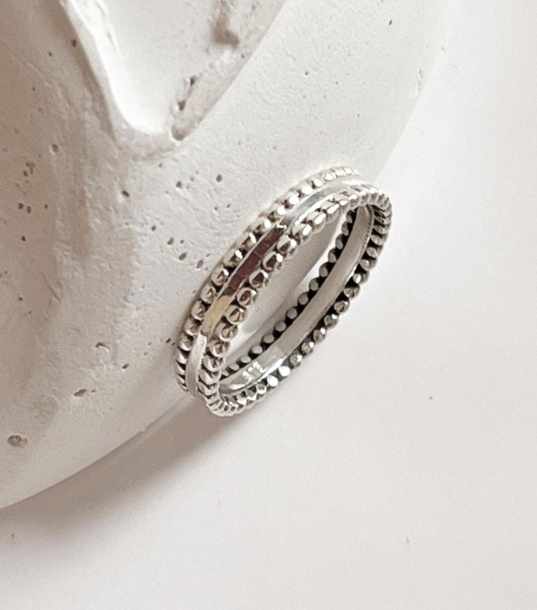 Handcrafted double rawa silver band ring with refined silver beads