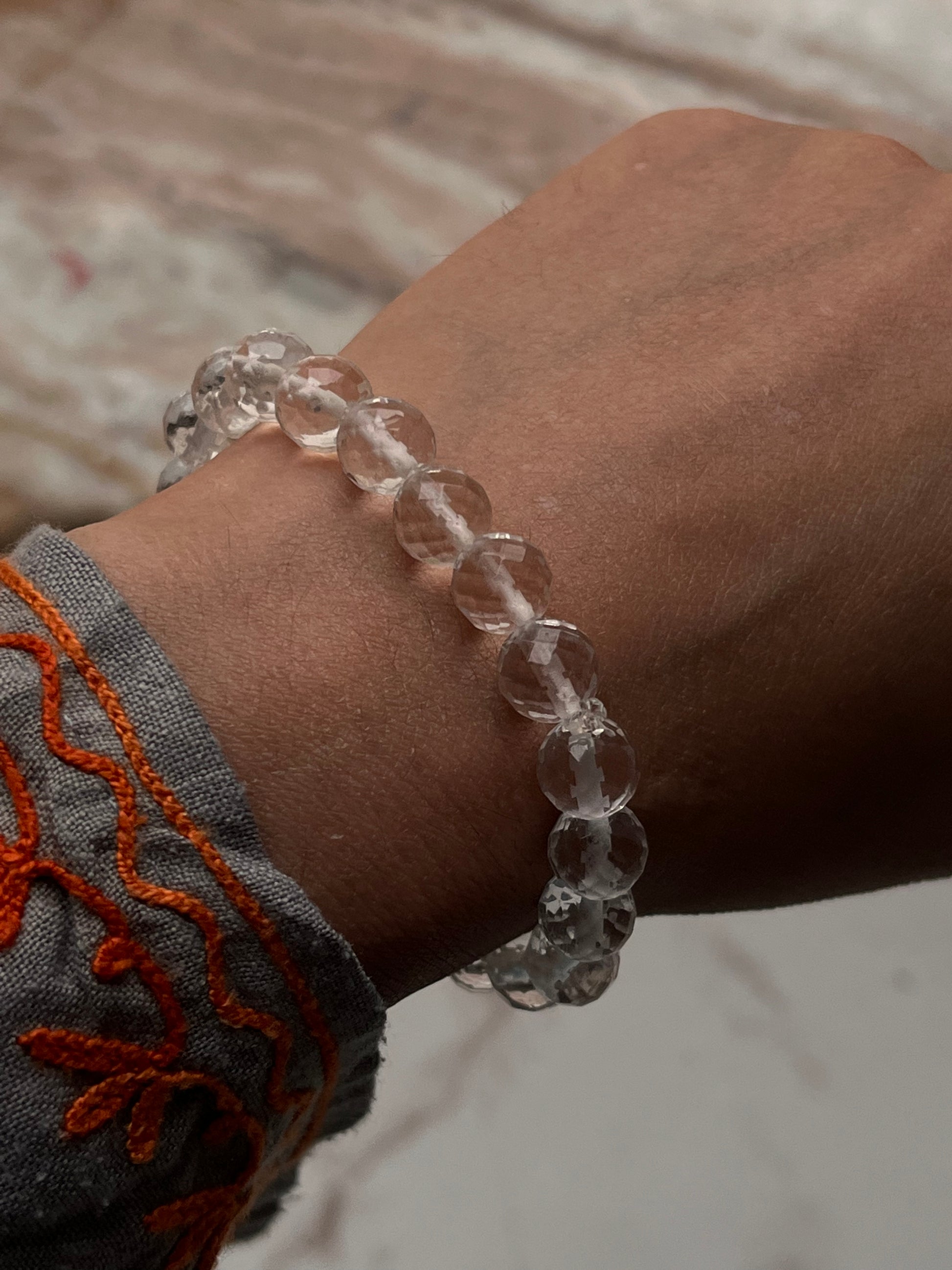 Handmade 8mm clear quartz crystal bracelet with faceted finish  
