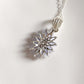 Handcrafted tanzanite flower pendant in sterling silver
