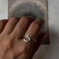 Beach-inspired handcrafted silver ring with wave design