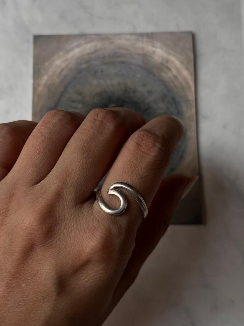Beach-inspired handcrafted silver ring with wave design