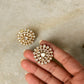 925 Sterling Silver Gold Plated Antique Moissanite Polki Earrings held in hand on marble background.