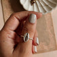 Handcrafted silver ring featuring a natural cowrie seashell design