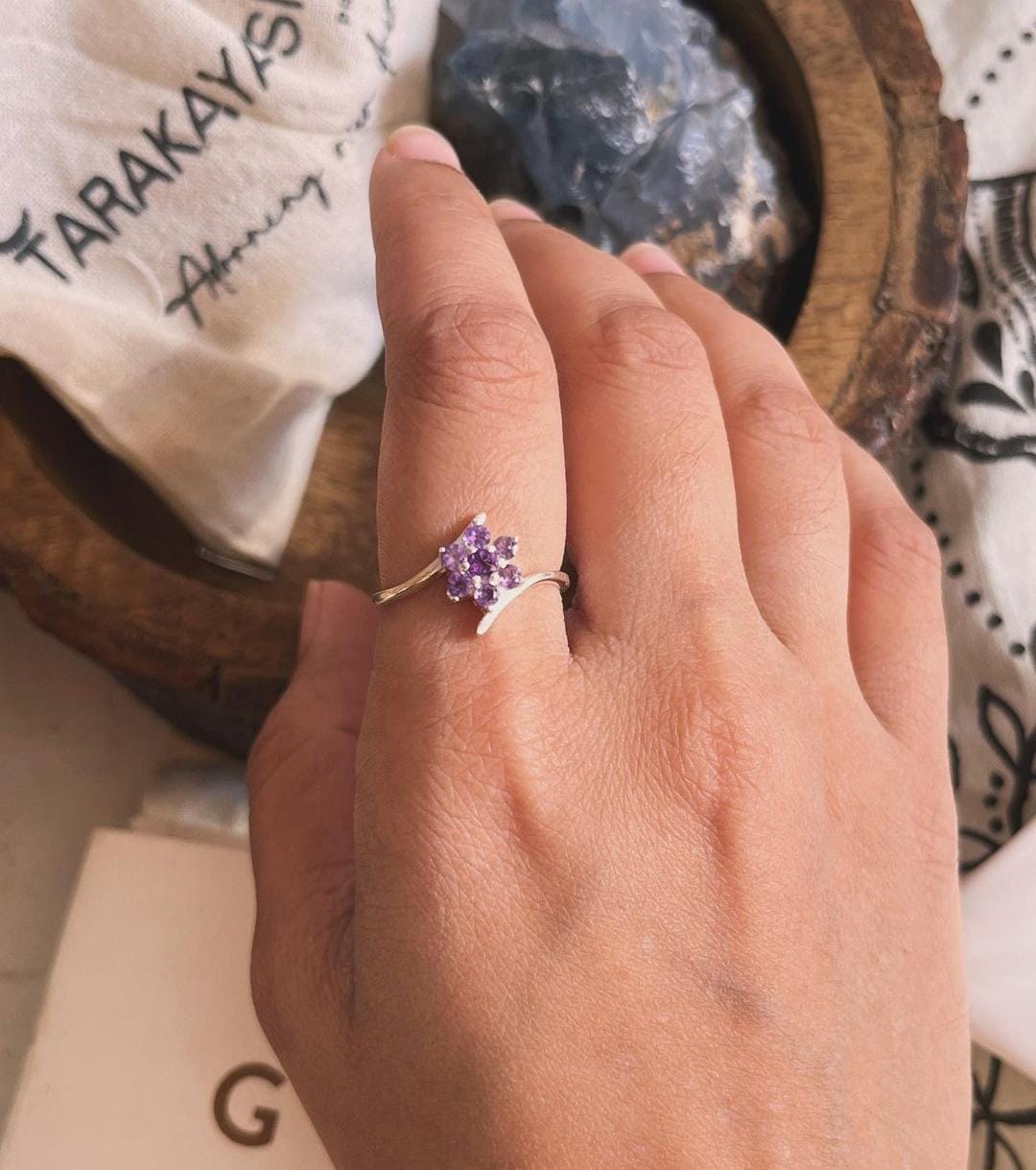 Delicate Silver Ring with Amethyst Center and Flower Design