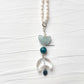 Handmade aquamarine butterfly crystal pendant close-up  