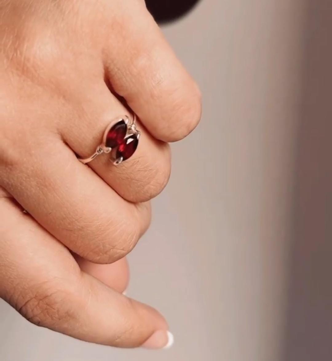 Sophisticated silver ring with two marquise-cut garnet gemstones