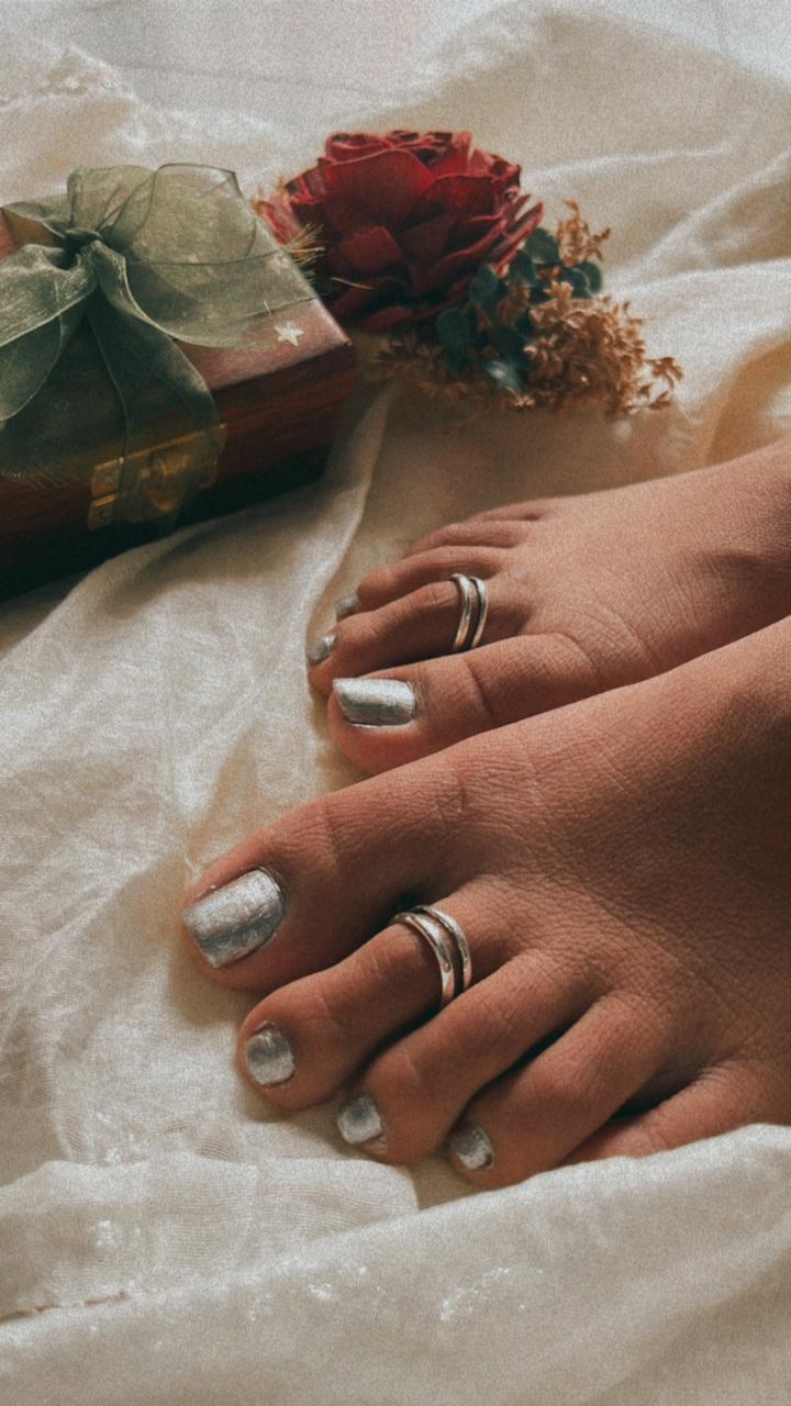 Close-up of double stack pure silver toe ring with refined detailing