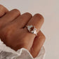 Close-up of citrine divine lotus ring with detailed silver petals