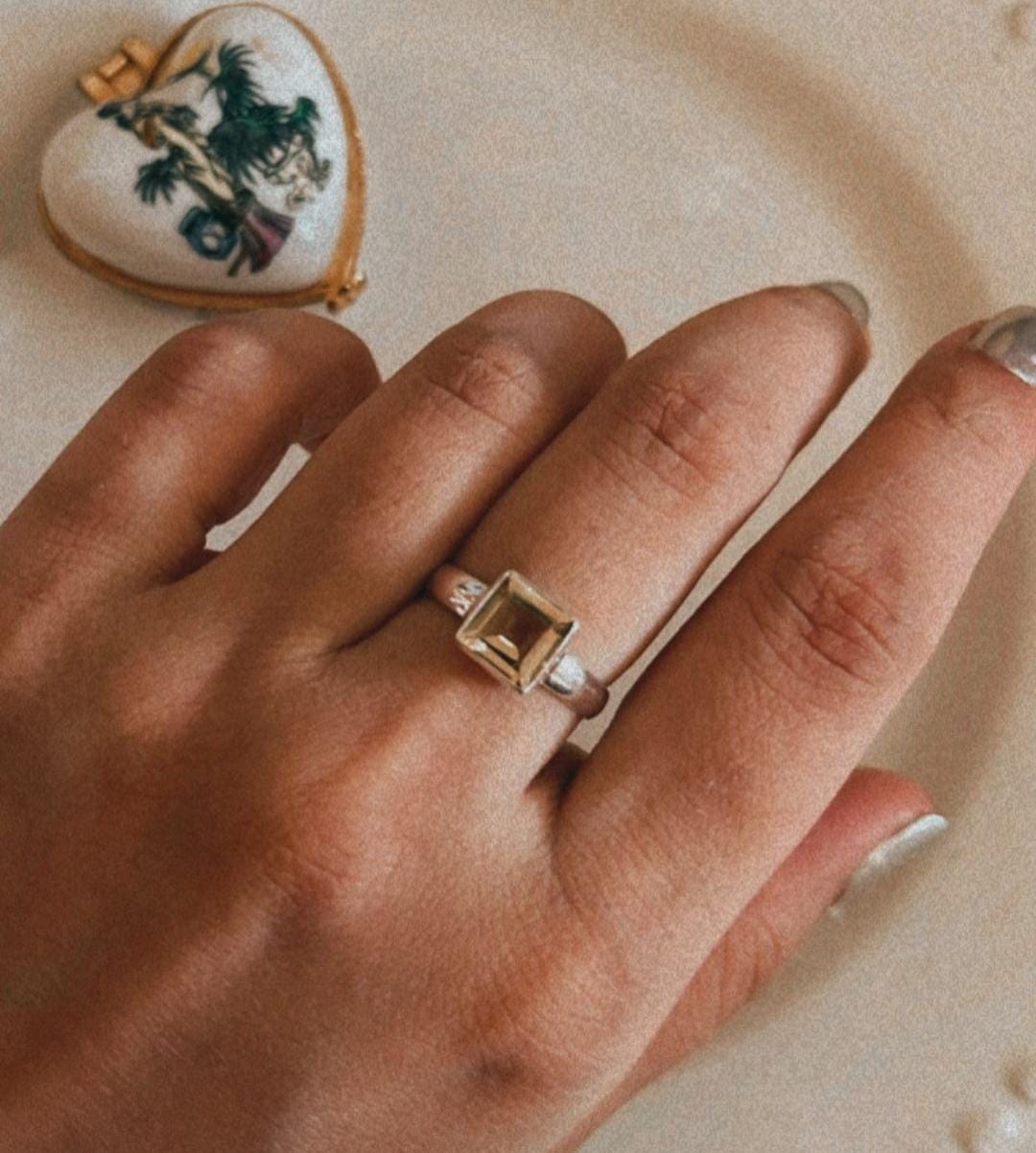 Sleek citrine square cut stone set in a polished silver band