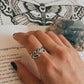 Intricate vines and leaf design silver ring
