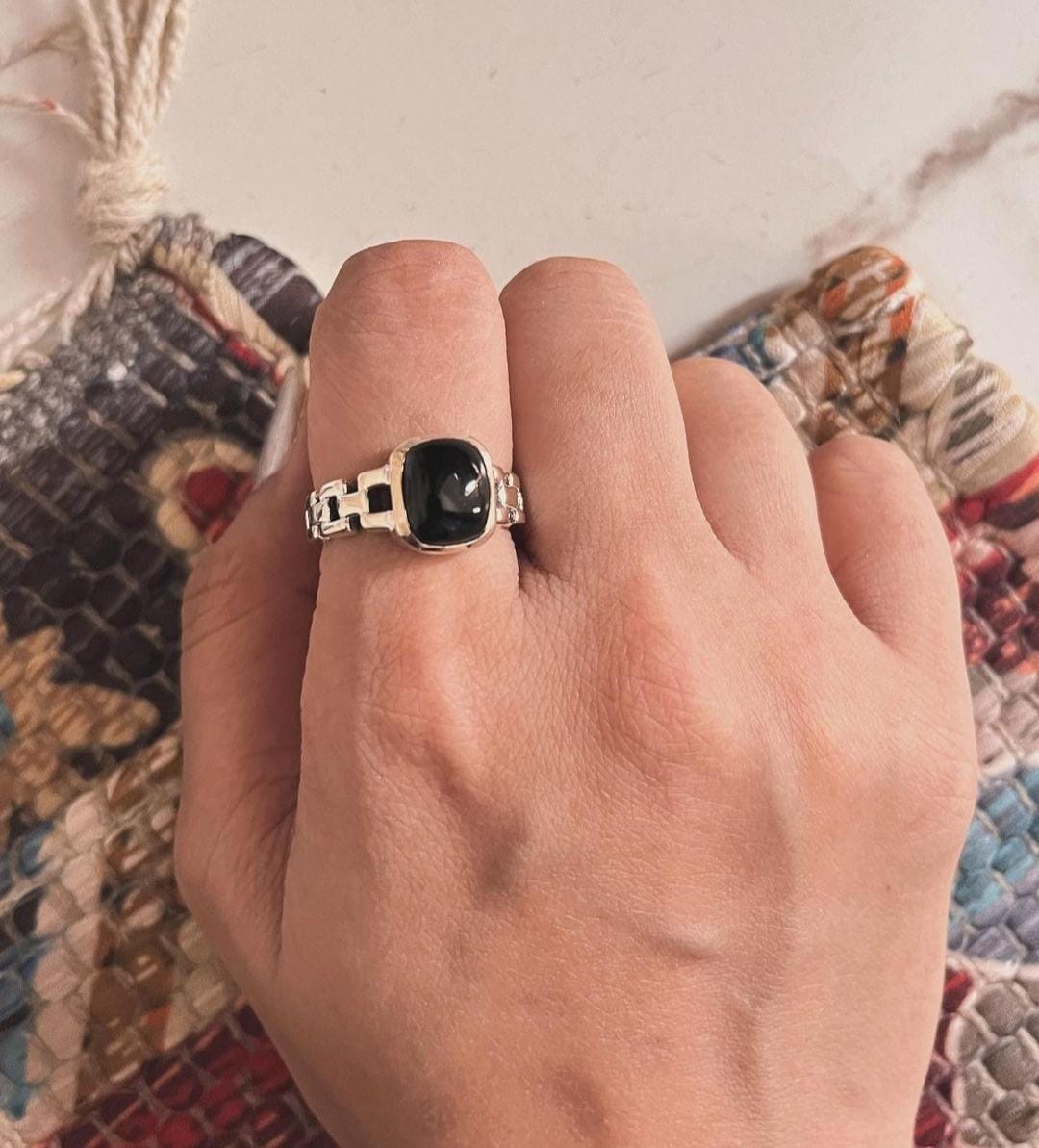 Timeless black onyx and Cuban link silver ring with sleek craftsmanship.