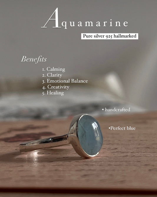 Elegant natural aquamarine oval silver ring with sleek design.