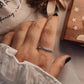 Simple hammered band ring in polished sterling silver