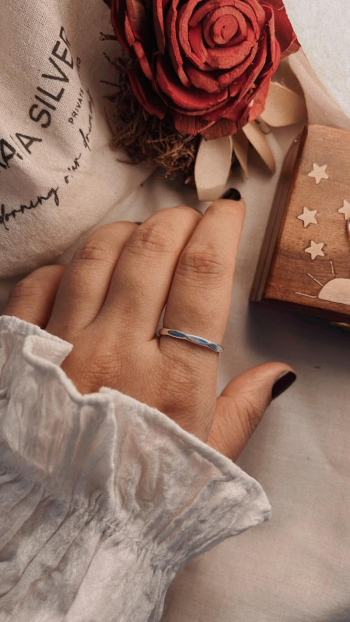 Simple hammered band ring in polished sterling silver