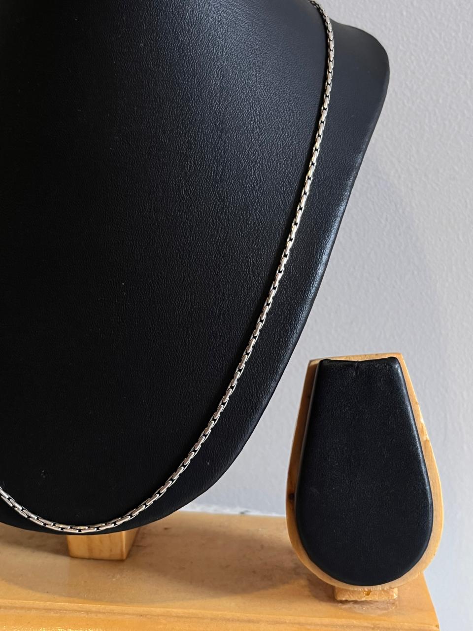 Antique patterned sterling silver chain with detailed craftsmanship.