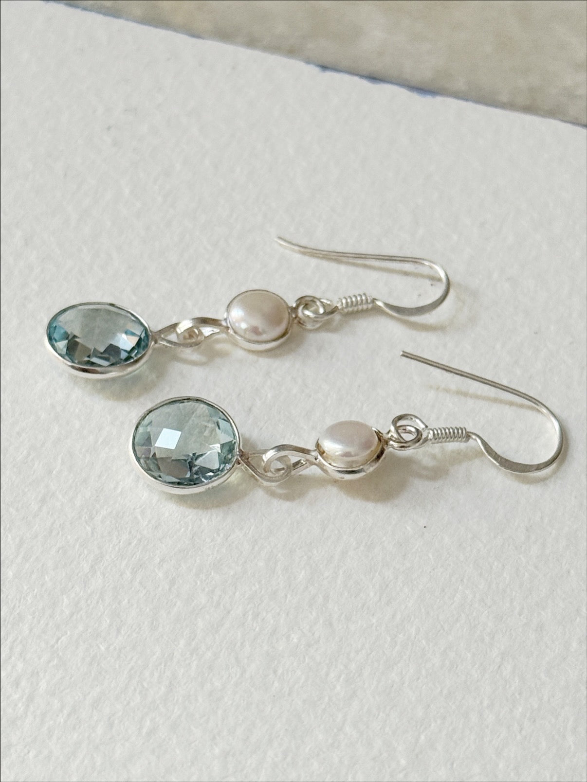 925 silver earrings featuring checkerboard blue topaz and pearl