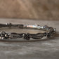 Handmade sterling silver statement bangle with blue topaz gem