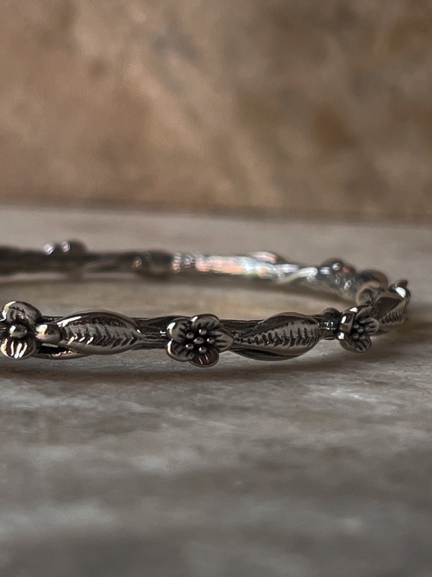 Handmade sterling silver statement bangle with blue topaz gem