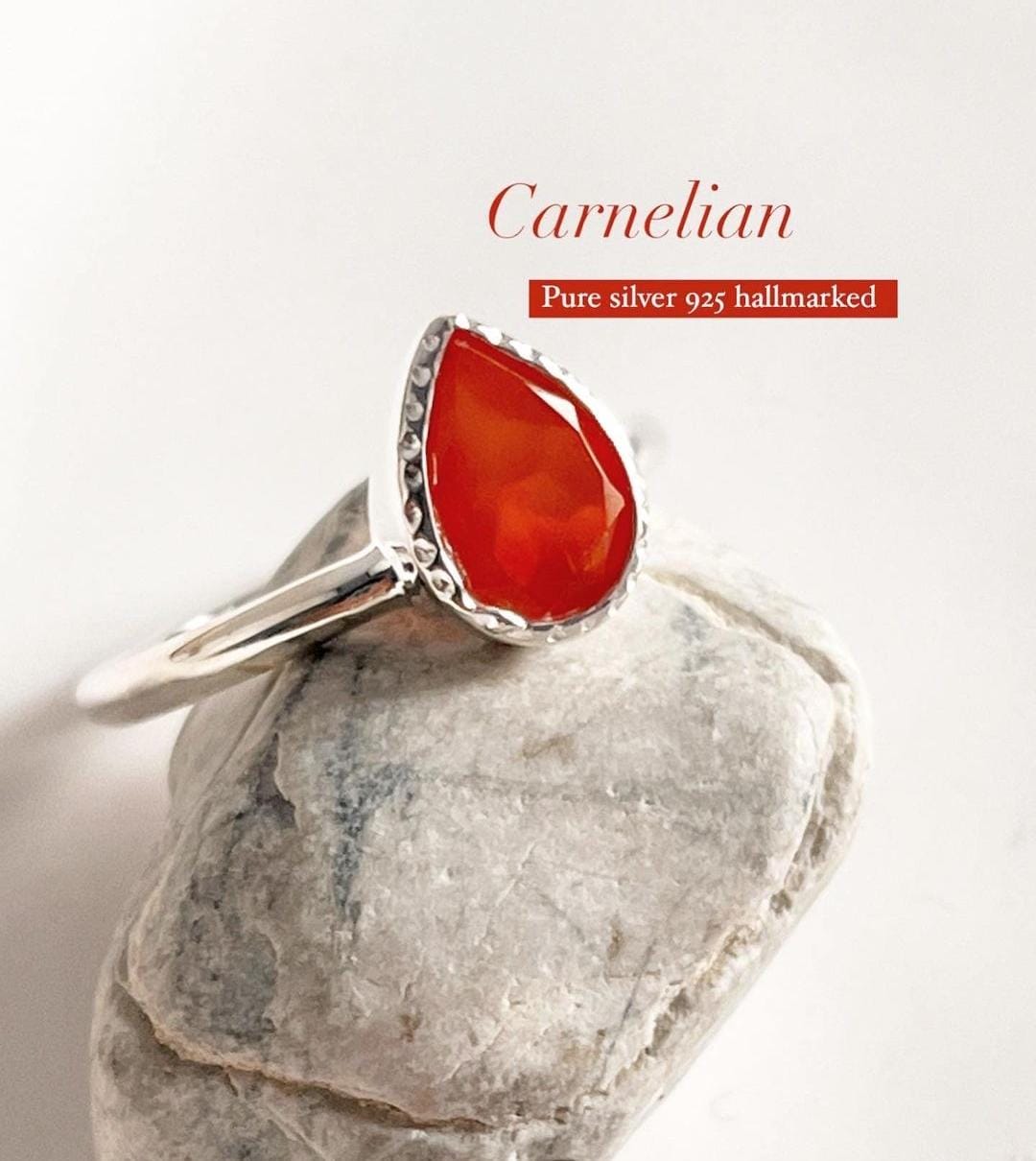 Carnelian pear-shaped stone set in a silver ring