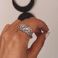 Elegant adjustable silver ring featuring a detailed garden-inspired design