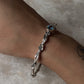 Elegant forest-inspired blue topaz statement bangle in 925 silver